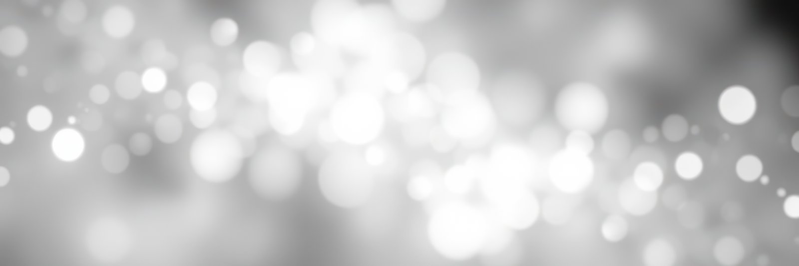 Soft, shimmering light patterns create a magical ambiance in a blurred background setting